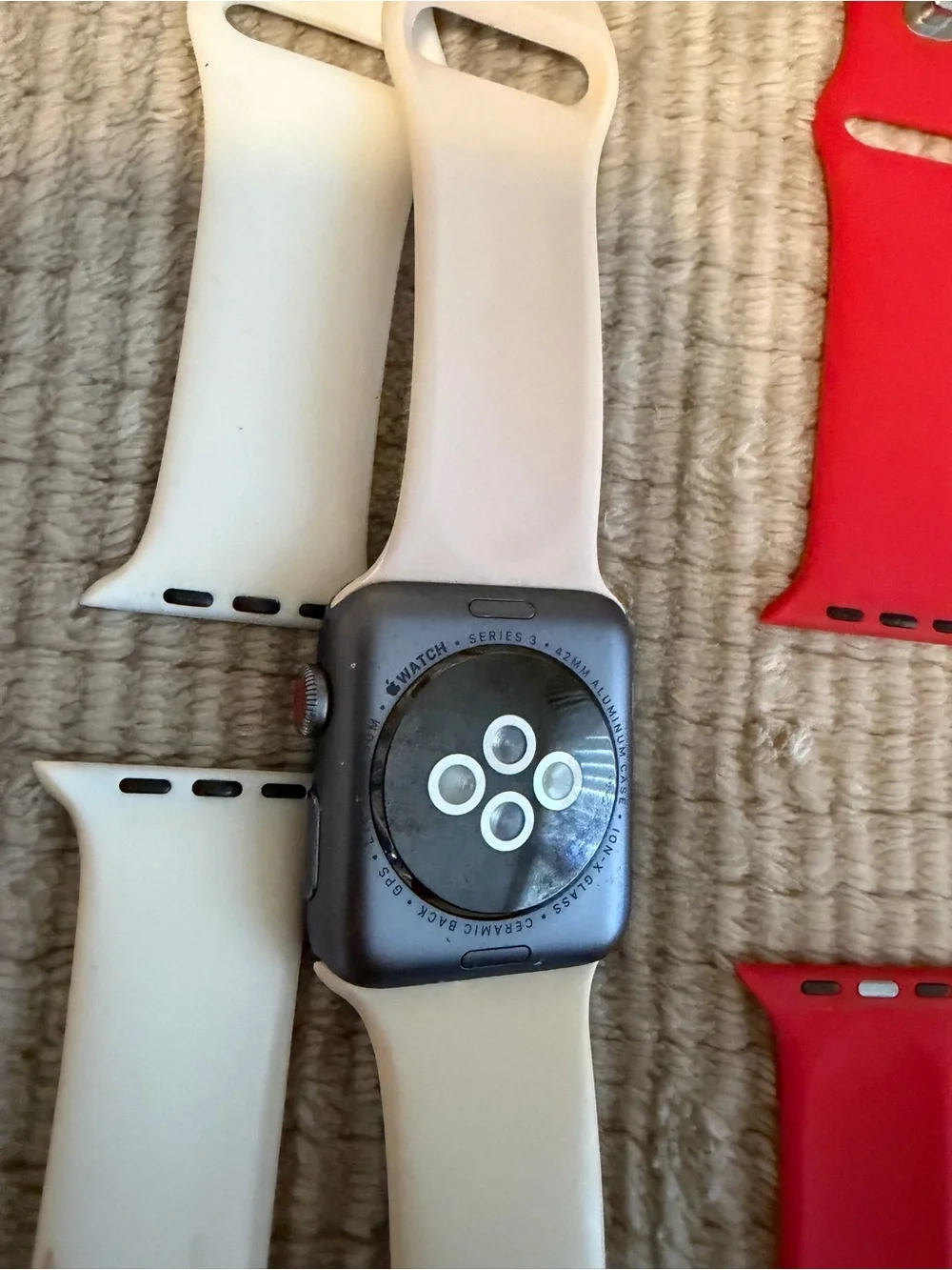 Apple Smartwatch with White, Red, and Blue Sport Bands